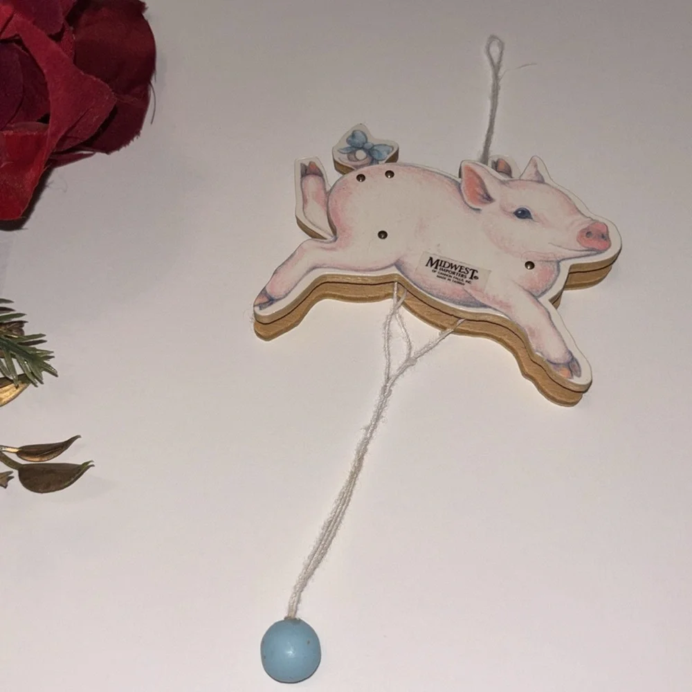Flying Pig ornament Midwest Importers Canon Falls Wooden Pull String Toy